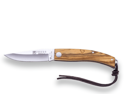 NAVAJA DEPORTIVA JOKER IBÉRICA ,DE PISTON, CACHAS EN MADERA DE OLIVO, ACERO INOX MOVA 1.4116 Y HOJA DE 7,5 CM. - Espadas y Más